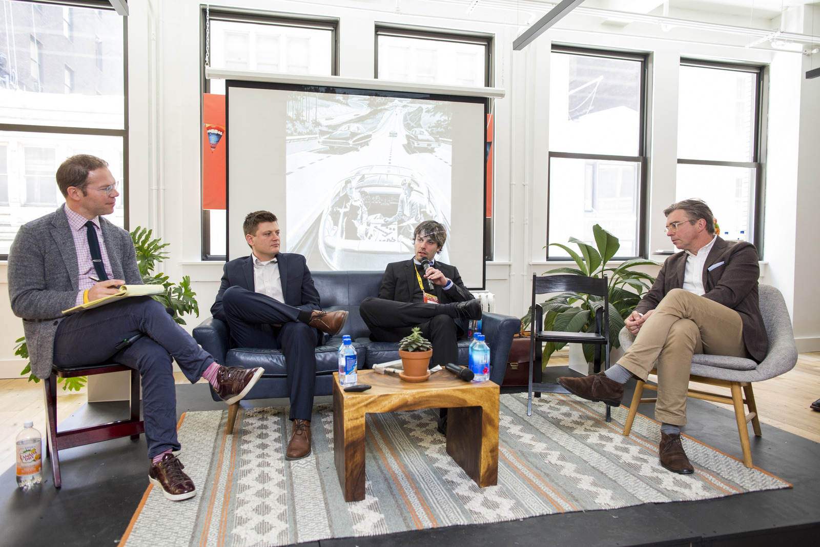 Torben Friehe on stage during a panel discussion in New York.